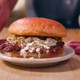 olive burger on table